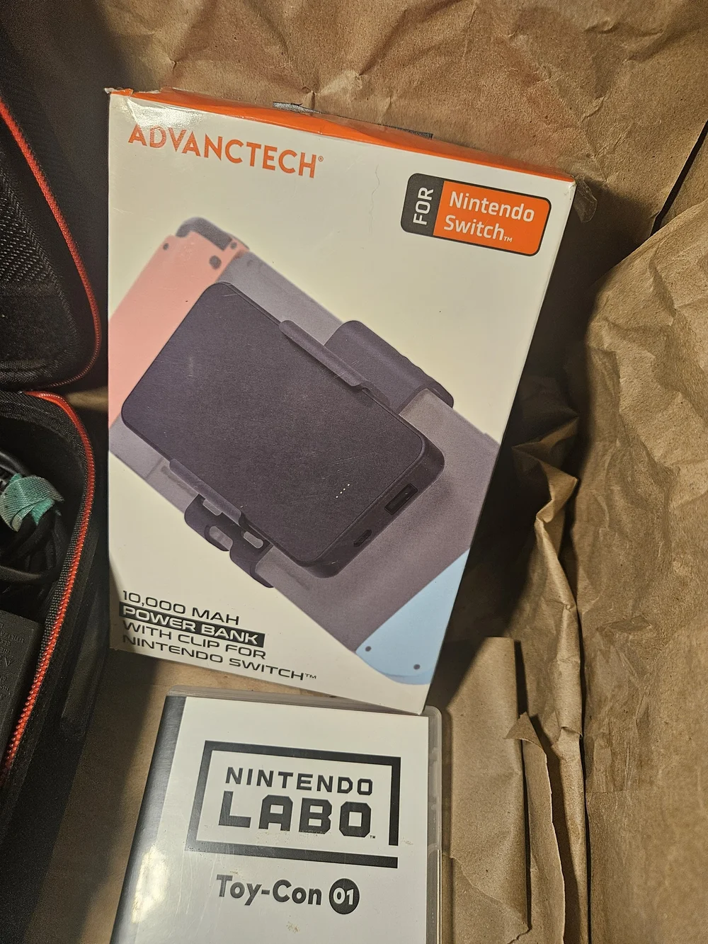Nintendo Switch Console with Orange Left & Blue Right Joy-Con and Travel Case
